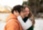 a woman hugging her fiance's head