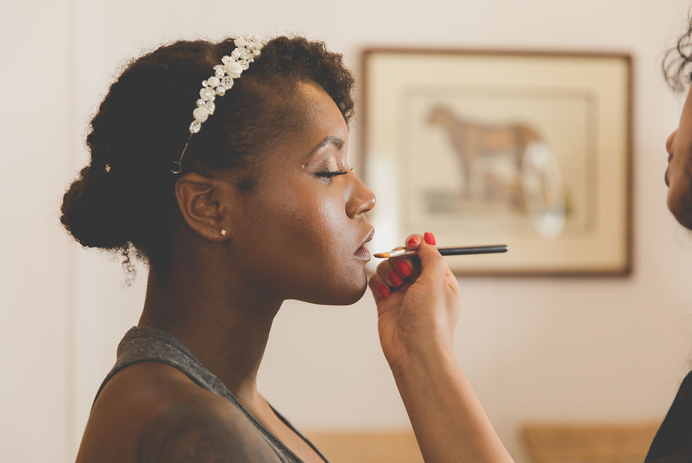 the bride getting lipstick put on
