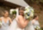 the bride and her sister hugging after the ceremony