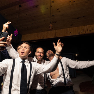 groom taking a selfie with his friends 