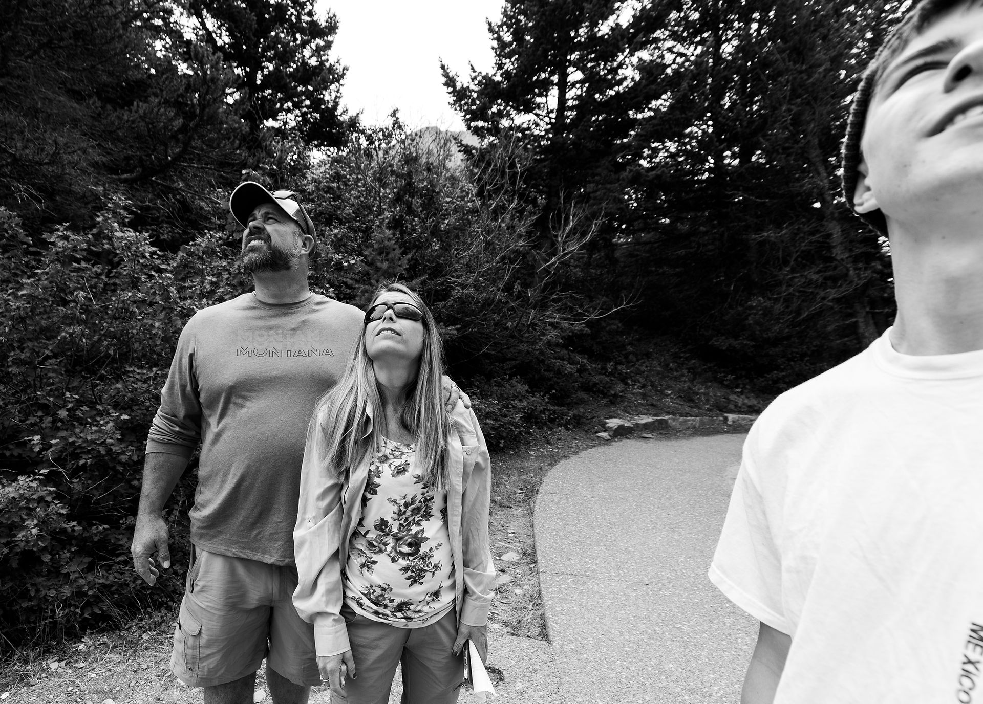family members looking up at the mountains 