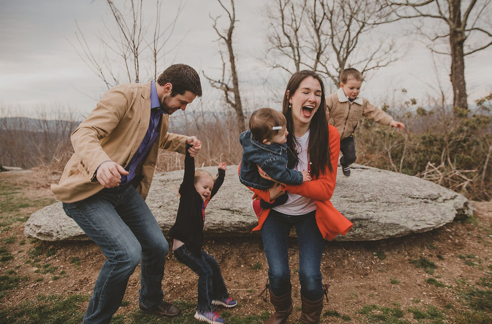 family of four running around and playing together