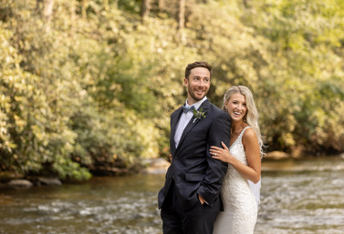 bride holding on to groom from behind