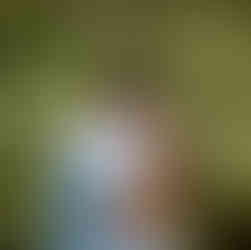 man hugging his fiance moments after his surprise proposal