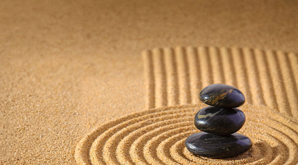 Stacked stones in sand