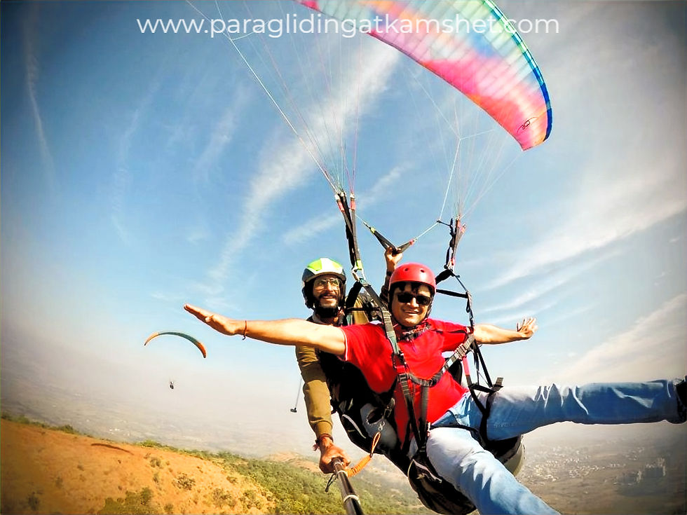 A paragliding instructor in Kamshet flying with a participant, part of the Kamshet paragliding adventure experience