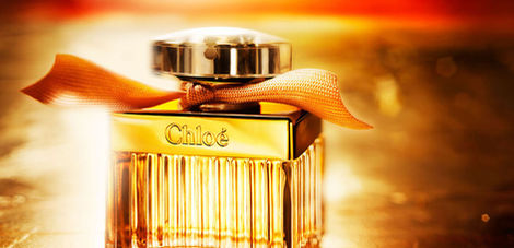 Chloé perfume bottle in warm golden light.