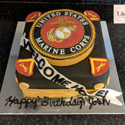 Welcome home birthday cake for U.S. Marine with fondant and edible image Marine Corps seal.