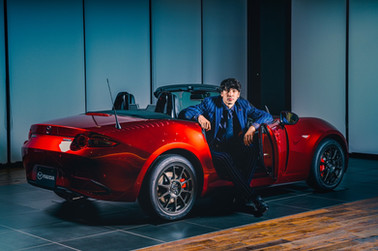 pin striped suit with Mazda.jpeg