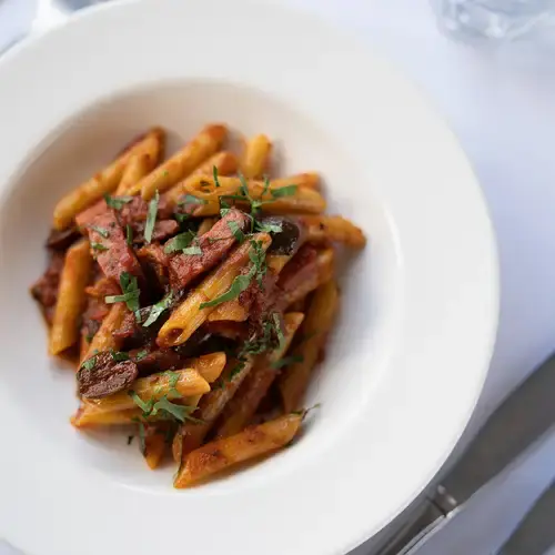 Classic Italian penne pasta with tomato sauce served in Melbourne restaurant