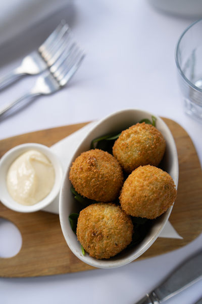 Italian arancini balls served in Melbourne restaurant with dipping sauce