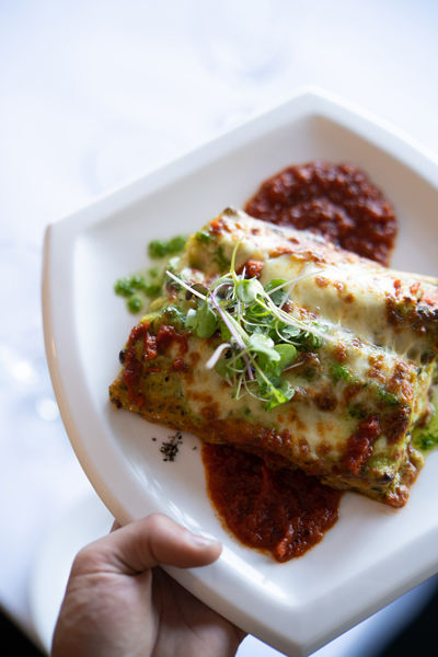 Classic Italian cannelloni served in Melbourne restaurant with rich sauce and cheese