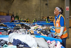 Clothing donations stacked and ready to support Goodwill DFW programs in Texas.