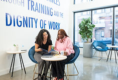Two people meeting at a Goodwill DFW career services center to explore training programs.