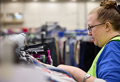 eam members sorting donations in a Goodwill Dallas warehouse, building job skills for the future.