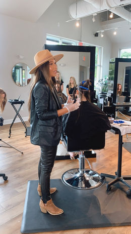 Cindy Bui teaching a balayage, backcombing, and dimensional hands-on workshop