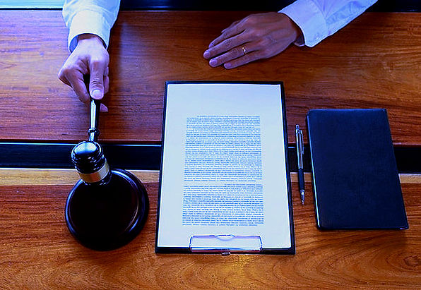 cropped-hands-male-judge-holding-gavel-w