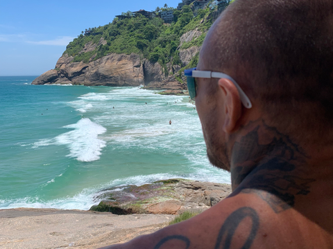 a man watching rio de janeiro beach waves