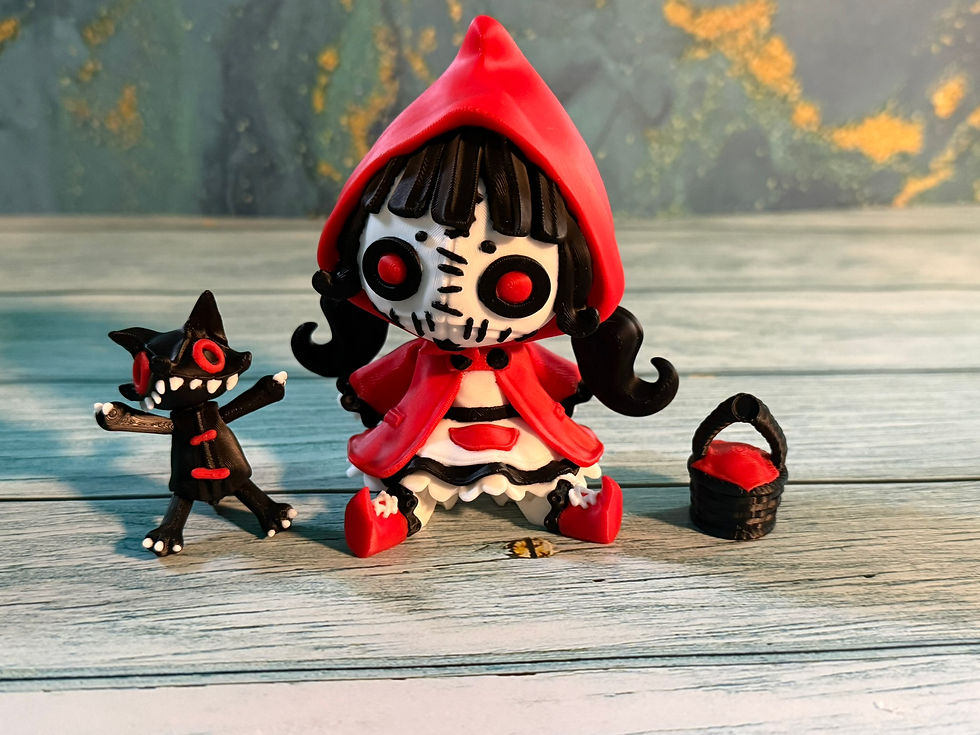 Thumbnail: Gothic Little Red Riding Hood doll with skull face, red eyes, stuffed wolf companion, and basket