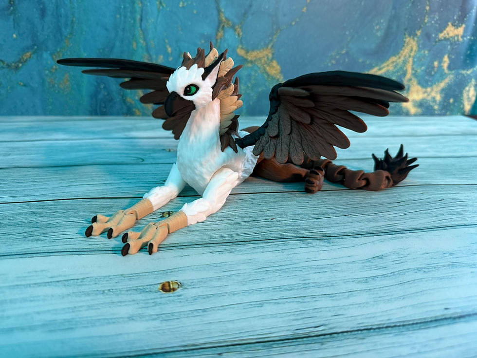 Thumbnail: Flexible griffin 3D print featuring black and white feathers with green eyes and articulated tail