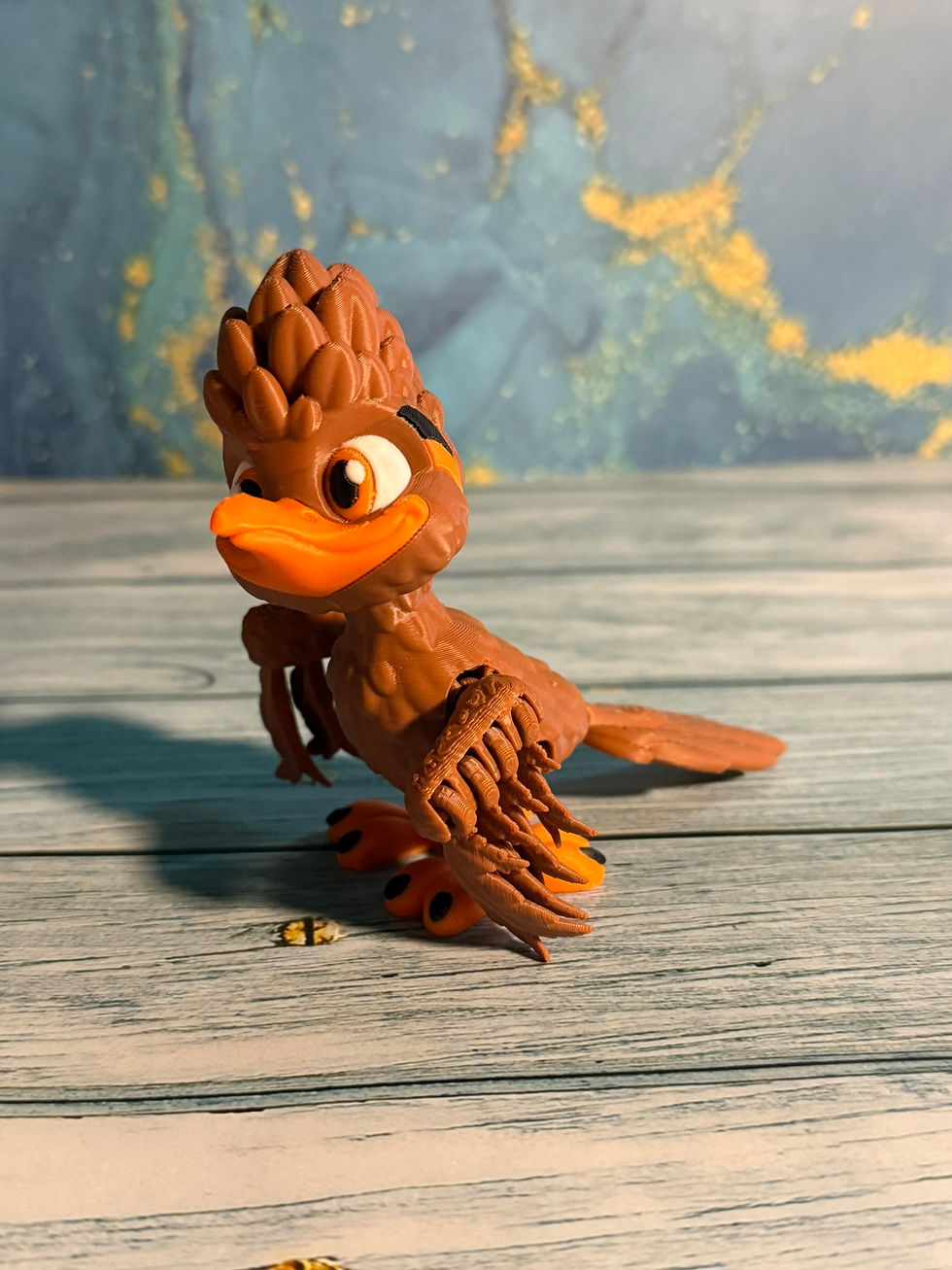 3D printed roadrunner bird figurine with textured feathers and orange beak