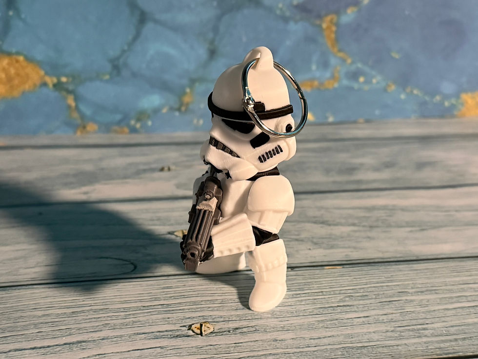 Armored Galactic Heavy Trooper 3D-printed keychain and bag charm holding a heavy blaster, measuring approximately 3.5 by 2 in