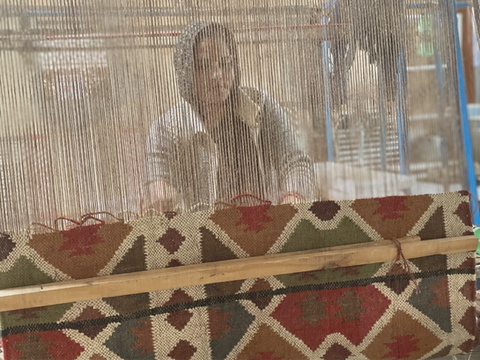 Punja Dhurrie weaving of Rajasthan, woman working on traditional hand loom to created geometrical designs.