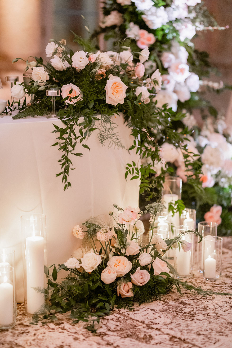 Soft pastel garden themed wedding sweetheart table with abundant florals made by Flowers Just For You a Chicagoland wedding florist