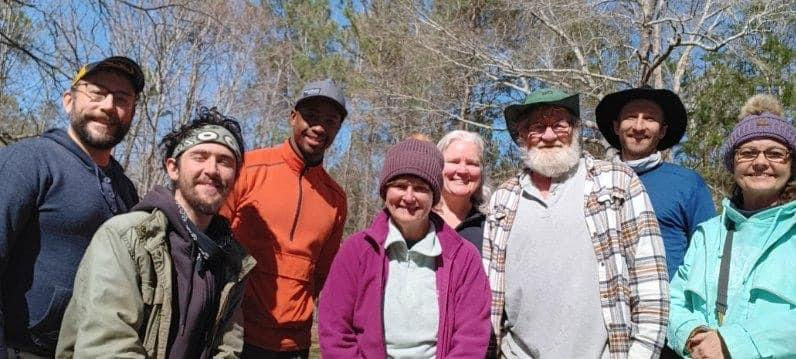 A group of 5 men and 3 women after a weekend of outdoor learning