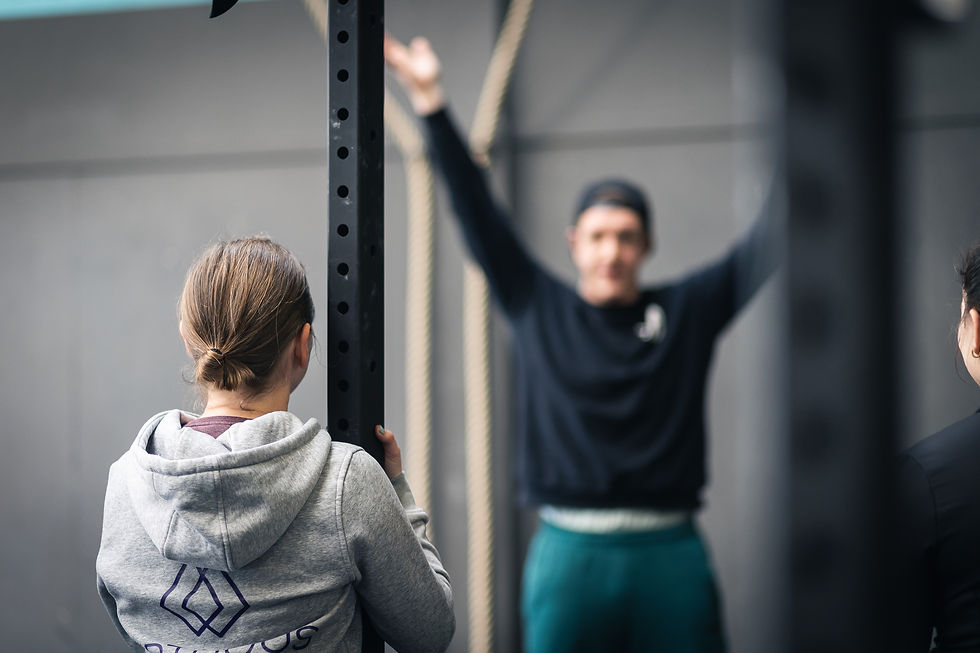 A crossfit coach observing movement