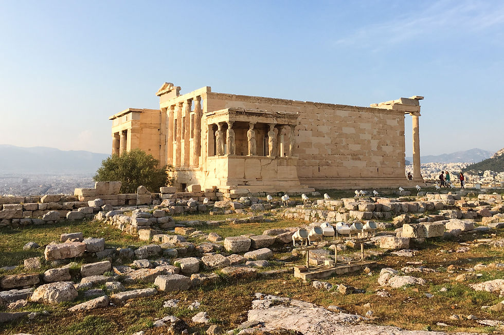 The Erechtheion temple surrounded by ancient ruins on the Acropolis of Athens