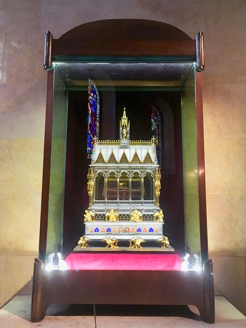 St. Stephen's Holy Right Hand kept in an ornately decorated gold box kept in a wooden glass case in Budapest