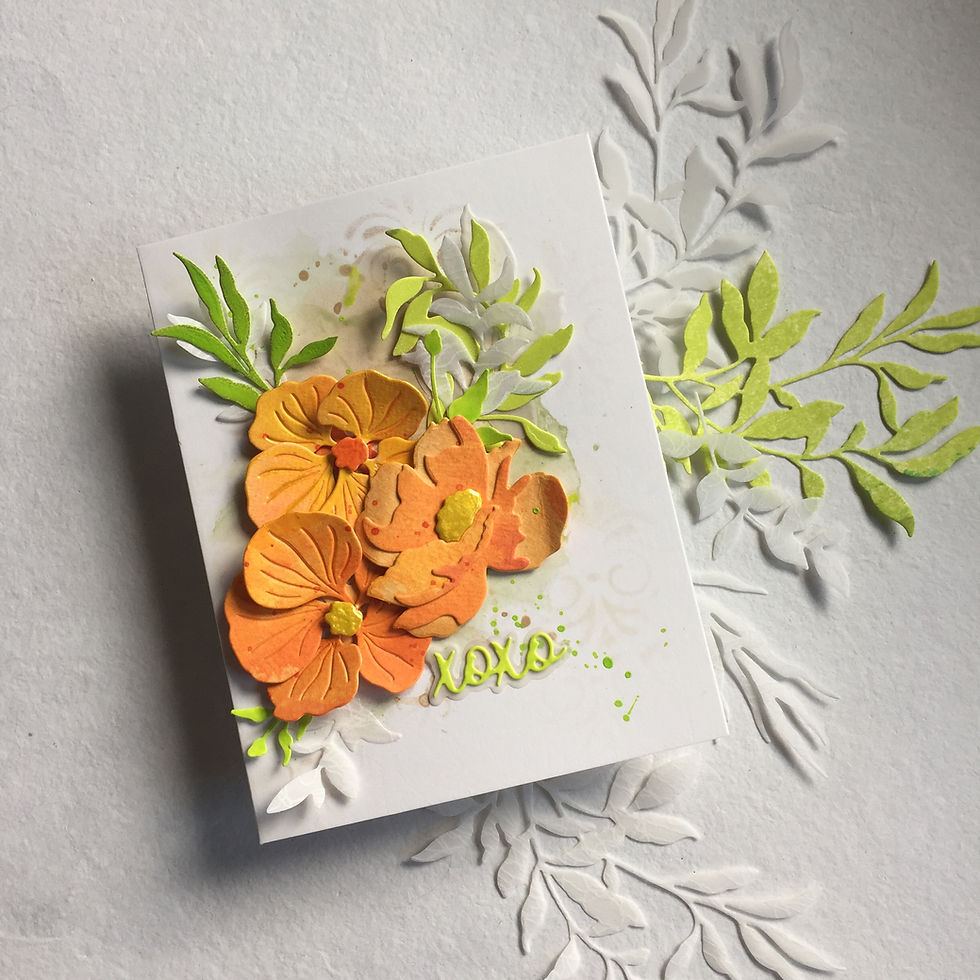 Mixed media card with with watercolor florals, stencilled texture, and die-cut greenery