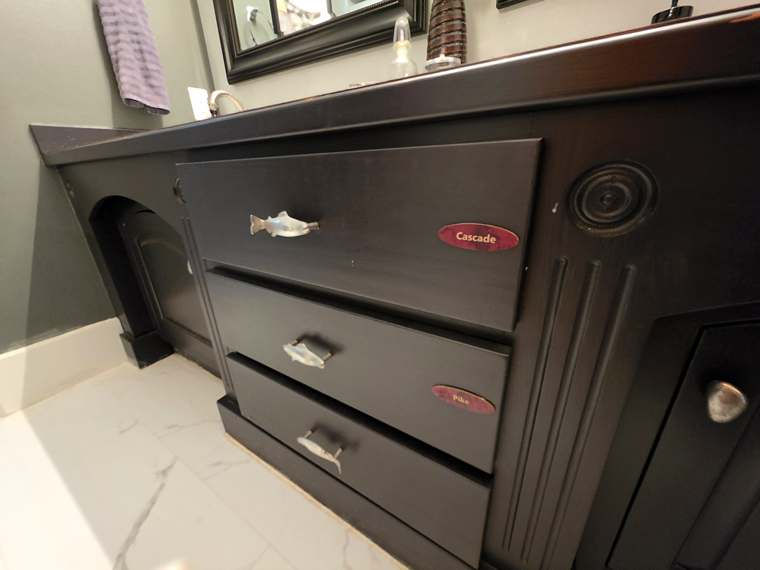 Bathroom vanity drawers labeled Cascade and Pike