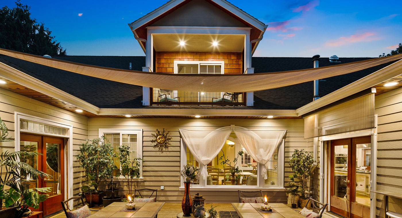 The Grayson courtyard at dusk &mdash; launch point for the interactive 3D estate walk-through