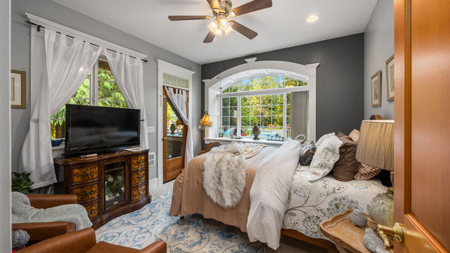 The Grayson B&B +Extended Stays | Cascade Suite bed by the arched picture window | PNW destination