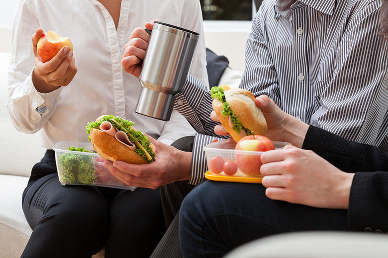 2 people eating a sandwich for lunch