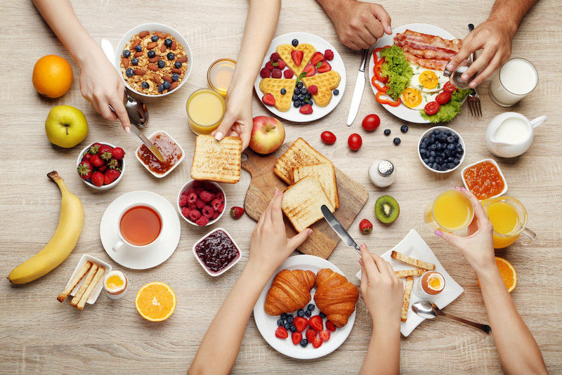 a table with breakfast foods