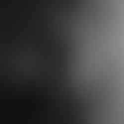 Client standing in a bathroom setting during a natural boudoir experience