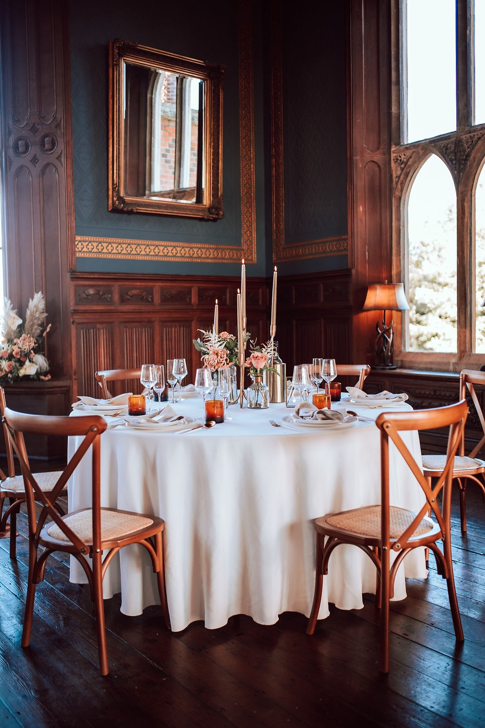 Round table with wooden chairs at St Osyth Priory