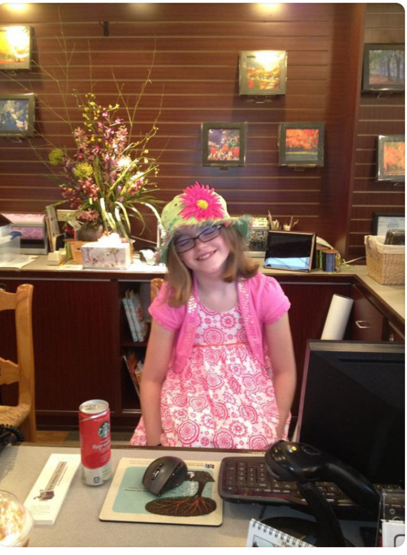 My daughter behind the desk at the original RBTL location-before it was her official first job!