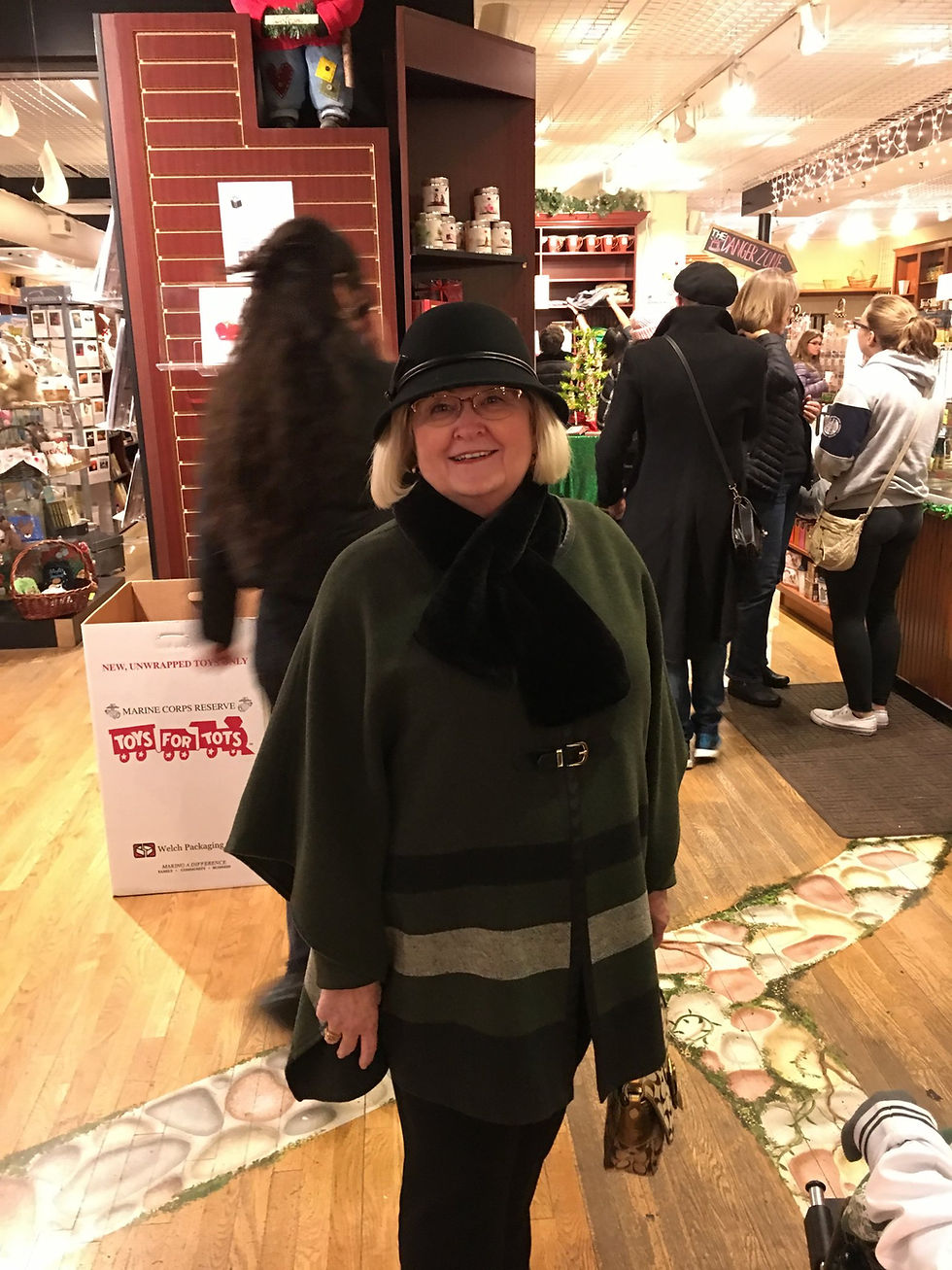 My mom supports the bookstore during the Lighting of the Square. One of the best traditions in Woodstock, and one of the busiest times for the small businesses on the Square! My mom is also quite a reader and shares that passion with me and her two granddaughters!