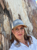 Author leans on the trunk of Red River Gum Tree