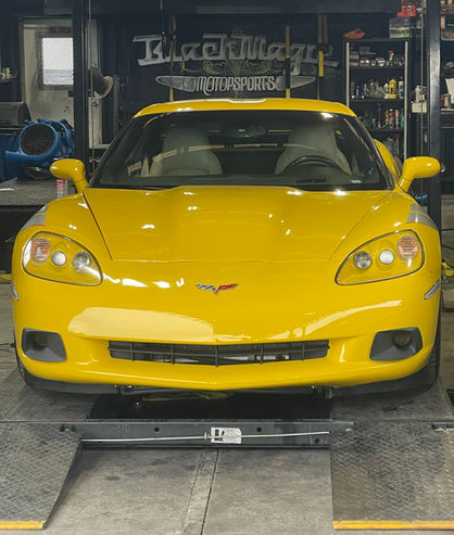 Yellow Corvette at Black Magic Motorsports