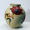 Thumbnail: Flower vase with red flowers