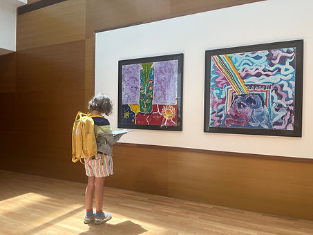 child infront of painting