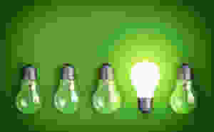 Idea concept with row of light bulbs and glowing bulb