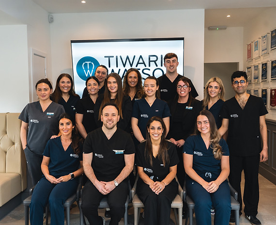 Dental team smiling in reception area