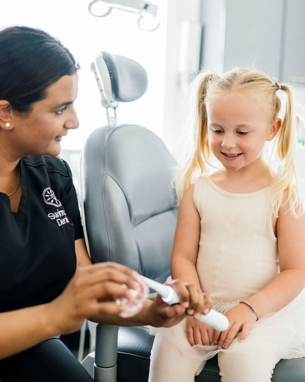 Dentist with child patient