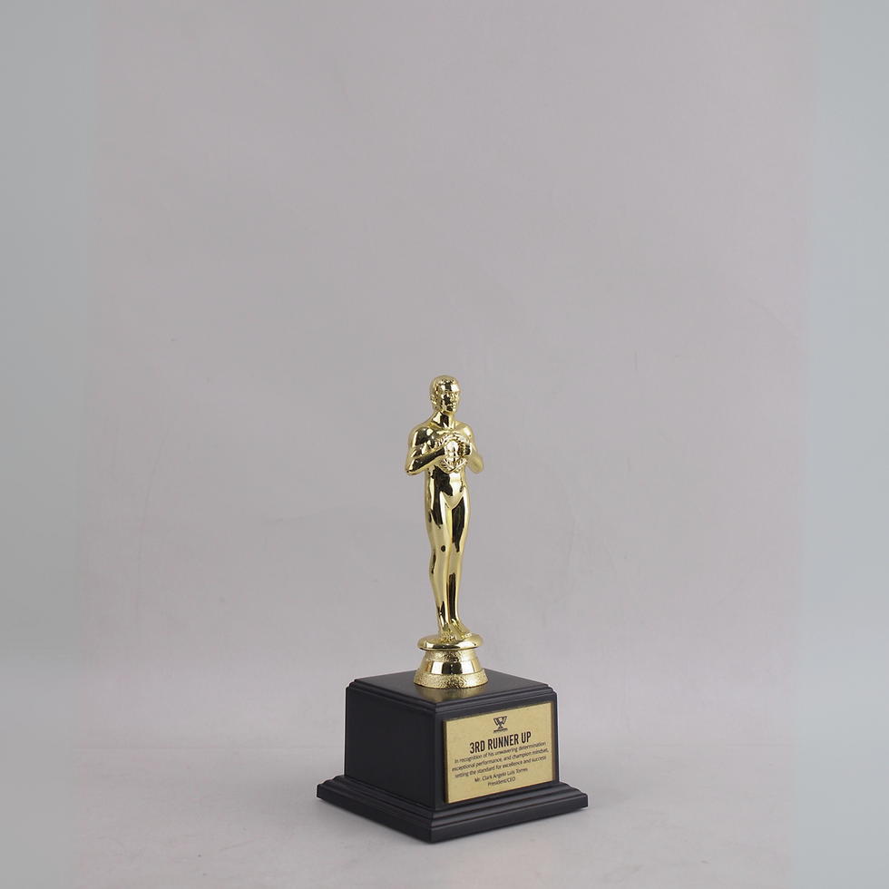 Thumbnail: - Classic standing figure with refined detailing.  - Gold finish exudes prestige and excellence.  - Mounted on a matte black